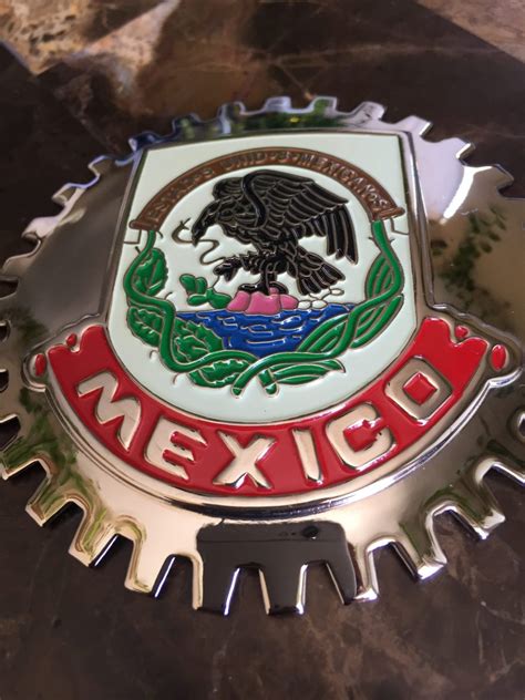 Mexico grill badge - grill badge. 2 long rods with screws. 2 nuts. 1 plate to be inserted on the back side. When I showed those to my Porsche dealer, they told me that "If you don't tighten the long screws properly, it will come loose, so please tighten them firmly with double nuts." I just had no idea what they are taking about.